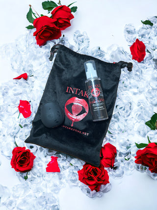INTAKE Black Rose toy on ice, surrounded by red roses.