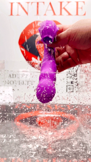 Waterproof demonstration of Sweet Motions purple vibrator under water droplets.