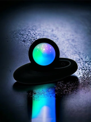 Glow-effect silicone anal plug with curved shape