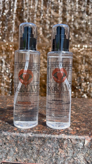 Two bottles of Soak’n Wet organic water-based lubricant on display