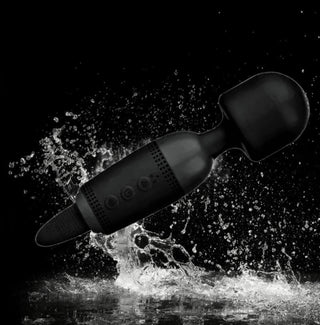 Magic Lick dildo wand massager with control buttons and sleek design.