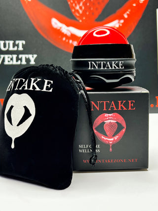 INTAKE massage ball on branded packaging with storage bag