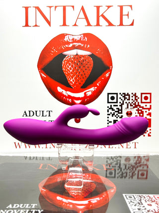 Purple dual-stimulation displayed on a glossy surface with INTAKE branding in the background.