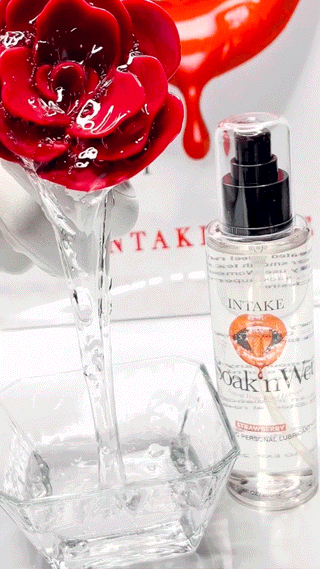 Rose flower dripping Soak’n Wet lube into a glass container