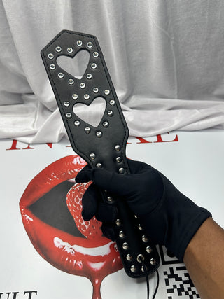 Black Love Taps paddle with polished studs and smooth PU leather finish.