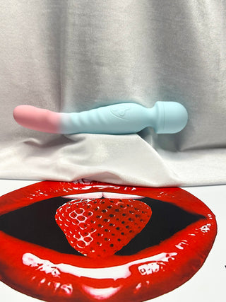 Gradient blue and pink Love Pulse vibrator on velvet background
