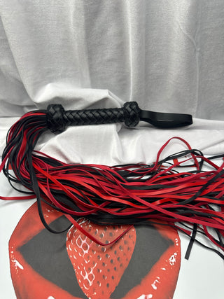 Close-up of the braided PU leather handle showing detail and wrist strap