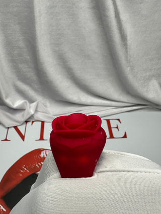 Blooming Rose Ring shown glowing in a neon purple setting, emphasizing power and design