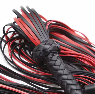 Dual-tone red and black whip strands spread out across the surface