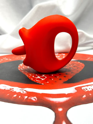 Top angle view of Tongue Kiss showing control buttons and curved ergonomic design for couples play.